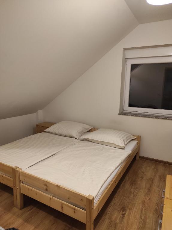 a bedroom with a bed and a large tv at Apartament Dobrzeń Wielki in Dobrzeń Wielki