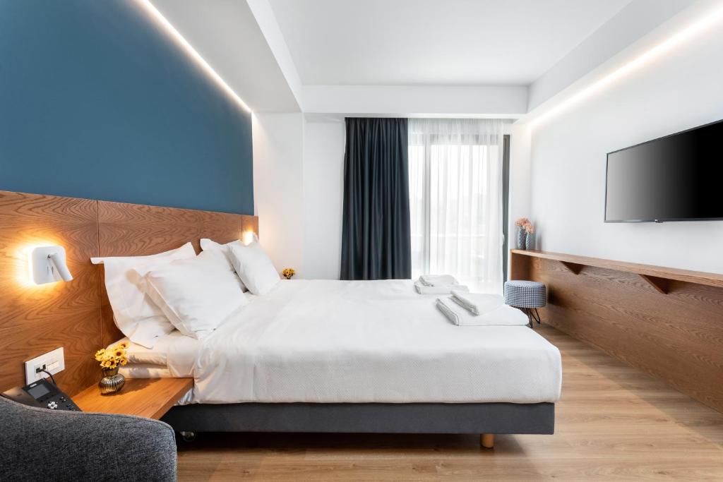Postel nebo postele na pokoji v ubytování DAYS City Suites