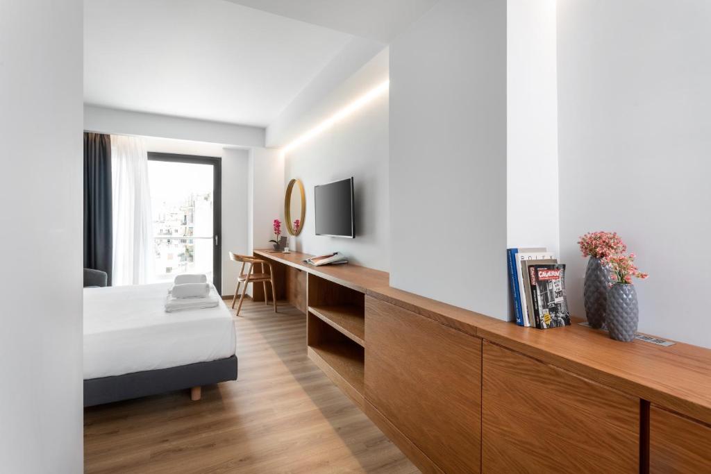 TV a/nebo společenská místnost v ubytování DAYS City Suites