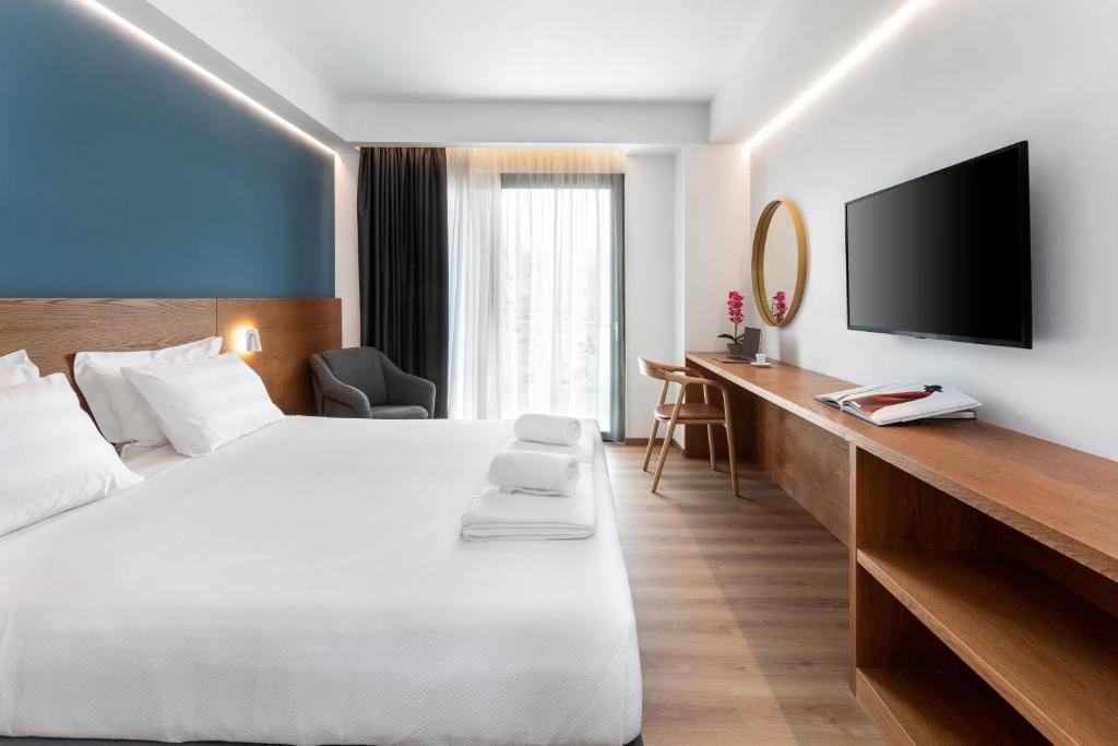 Postel nebo postele na pokoji v ubytování DAYS City Suites