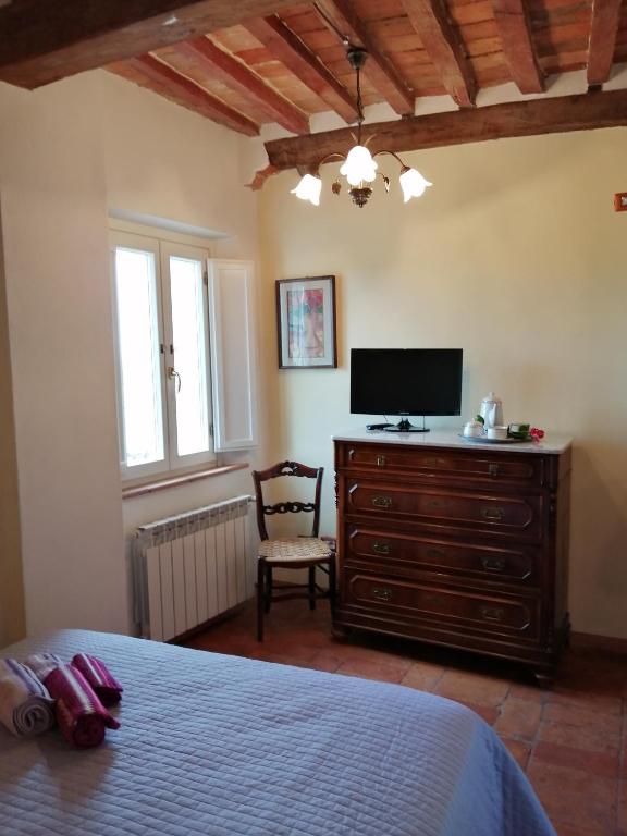 Posteľ alebo postele v izbe v ubytovaní La casa a Porta a Pago
