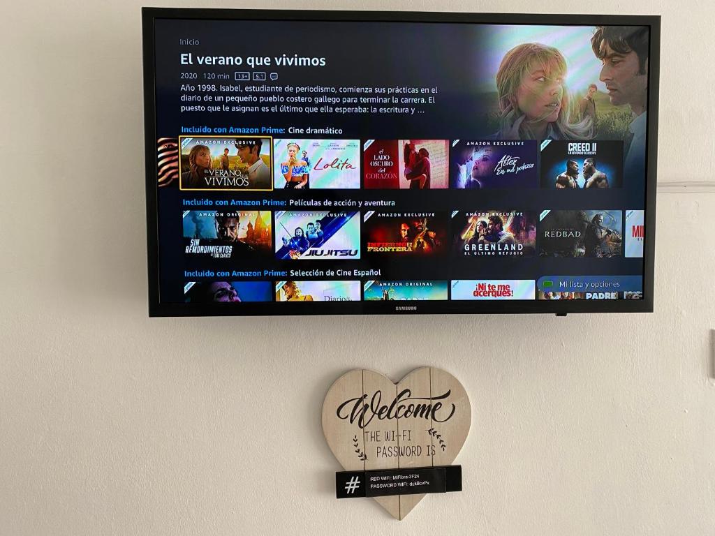 TV a/nebo společenská místnost v ubytování Playa Sol y Centro Historico