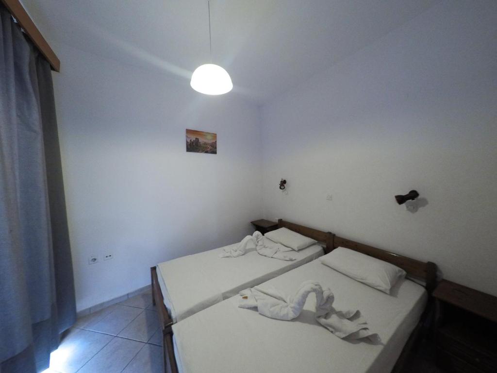 Postel nebo postele na pokoji v ubytování Harriets Apartments