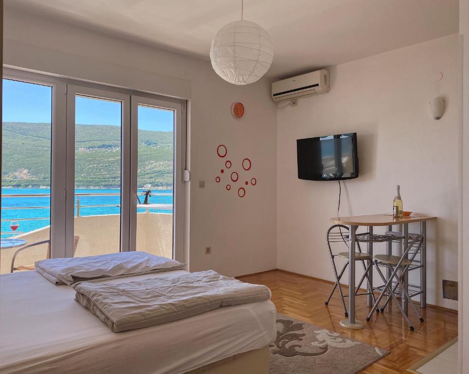 Postel nebo postele na pokoji v ubytování Apartments Bellevue - Otasevic