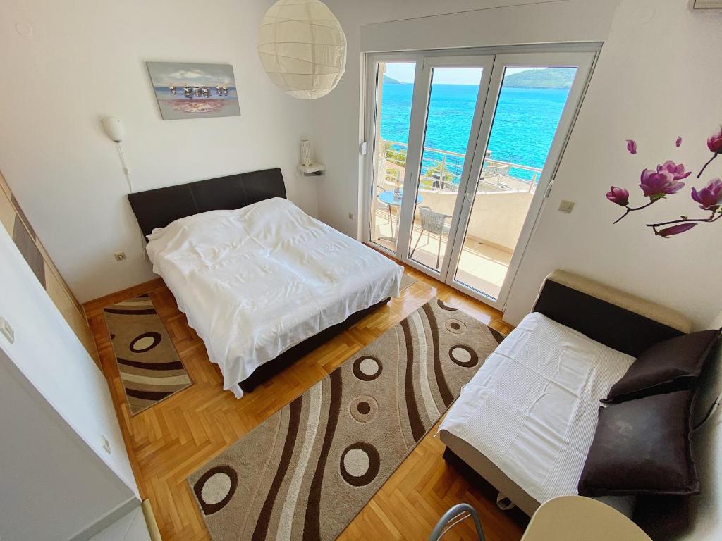 Postel nebo postele na pokoji v ubytování Apartments Bellevue - Otasevic