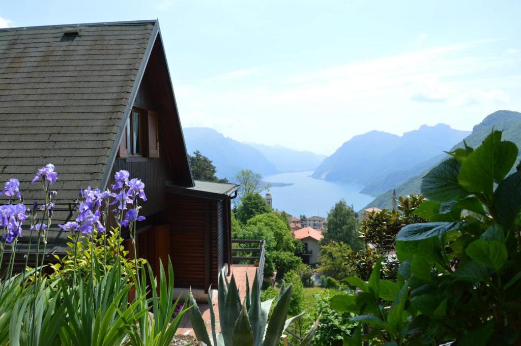 a house with a view of a lake and mountains at Bellagio Bellavista di Betty in Civenna