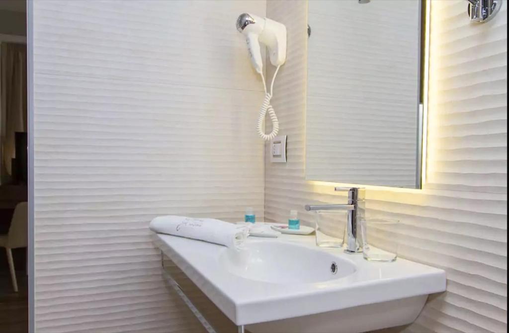 Koupelna v ubytování Ginevra Rooms