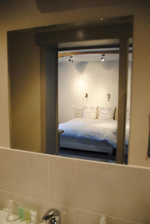 Postel nebo postele na pokoji v ubytování B&B De Oude Winning