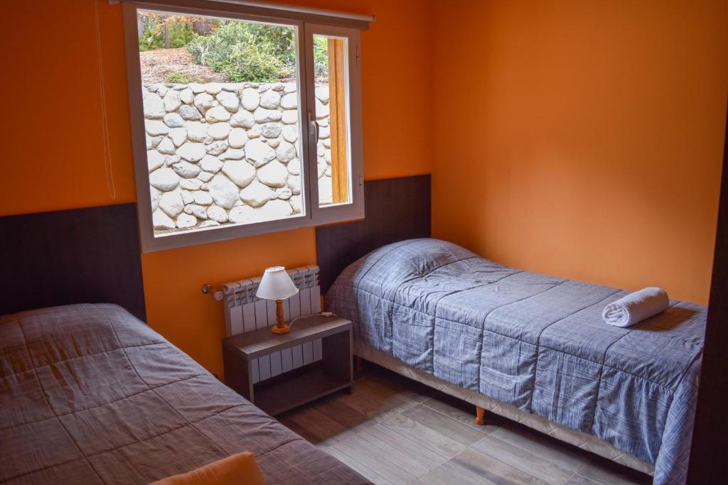 Postel nebo postele na pokoji v ubytování Cabañas Costa Maitena