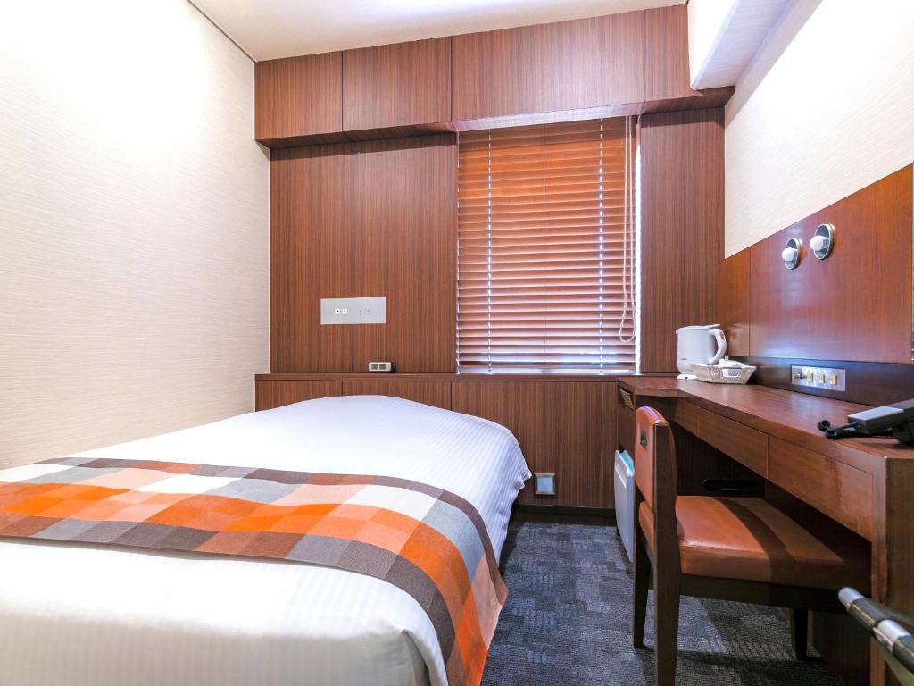 Postel nebo postele na pokoji v ubytování Central Hotel Okayama