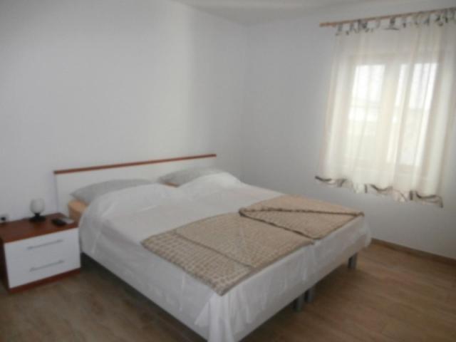 Postel nebo postele na pokoji v ubytování Room in Susak with air conditioning, W-LAN (3865-4)