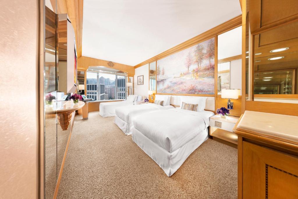Voodi või voodid majutusasutuse Regal Hongkong Hotel toas