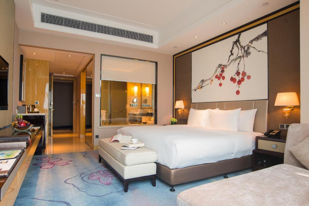 Postel nebo postele na pokoji v ubytování Wanda Realm Guangzhou Zengcheng