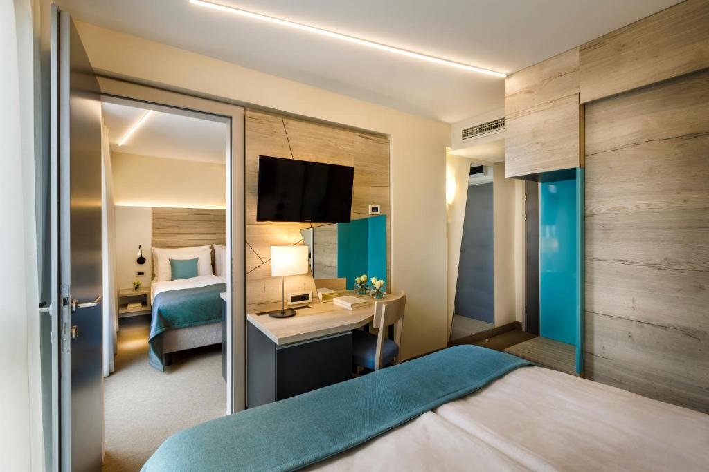 Postel nebo postele na pokoji v ubytování Hotel Marina - Liburnia