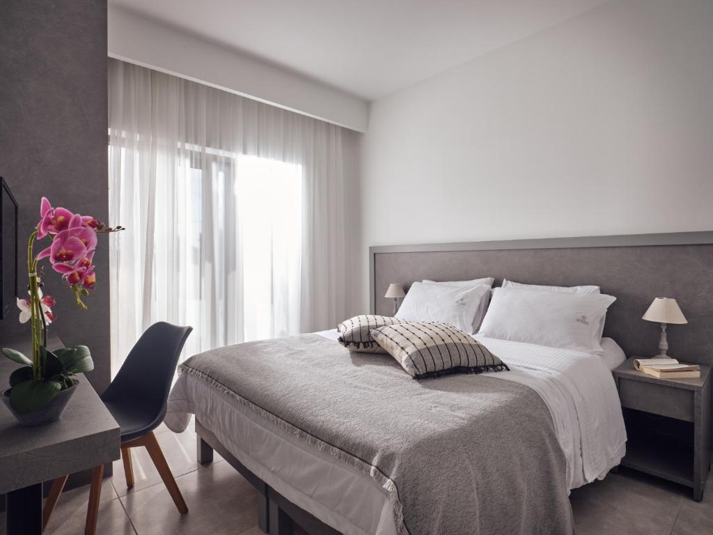 Postel nebo postele na pokoji v ubytování Dareia Suites