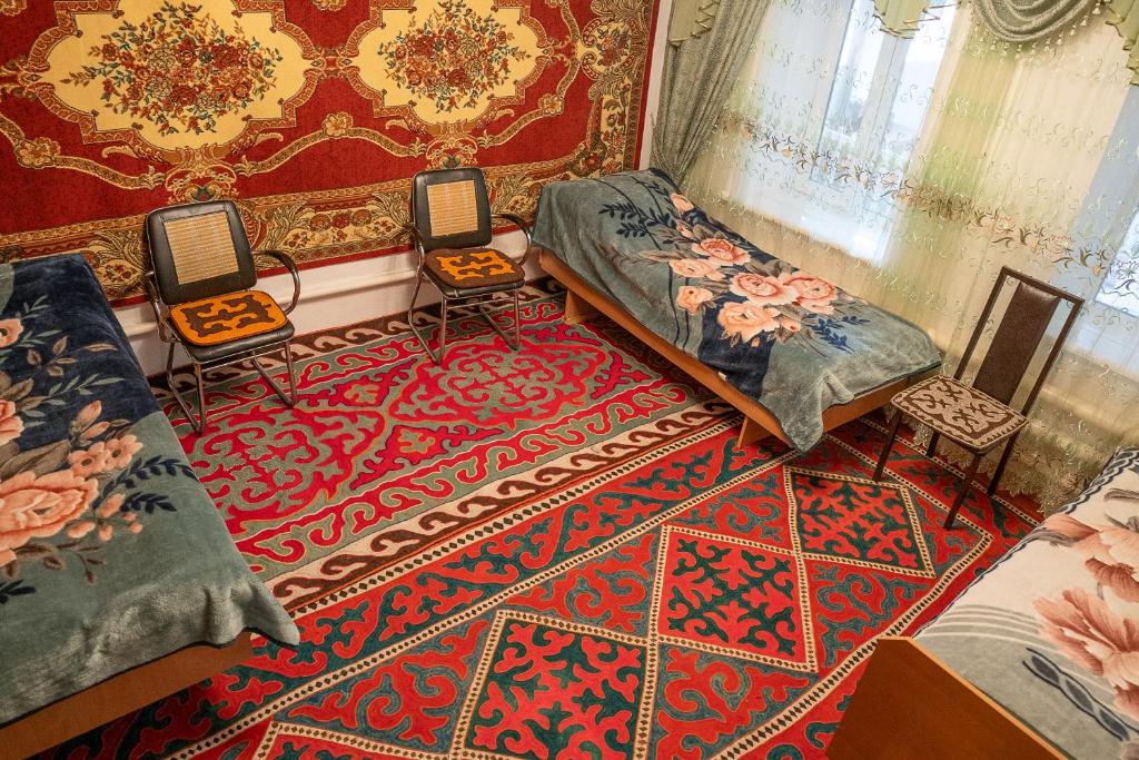 Postel nebo postele na pokoji v ubytování Guest House Jekshen