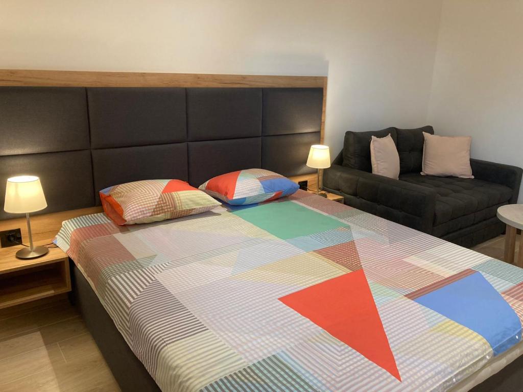 Postel nebo postele na pokoji v ubytování Vip Apartments Kopaonik