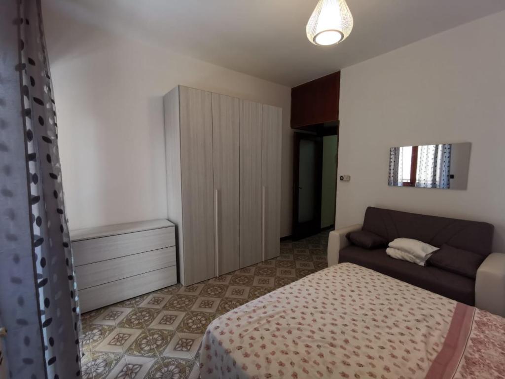 A bed or beds in a room at Casa Smeraldo