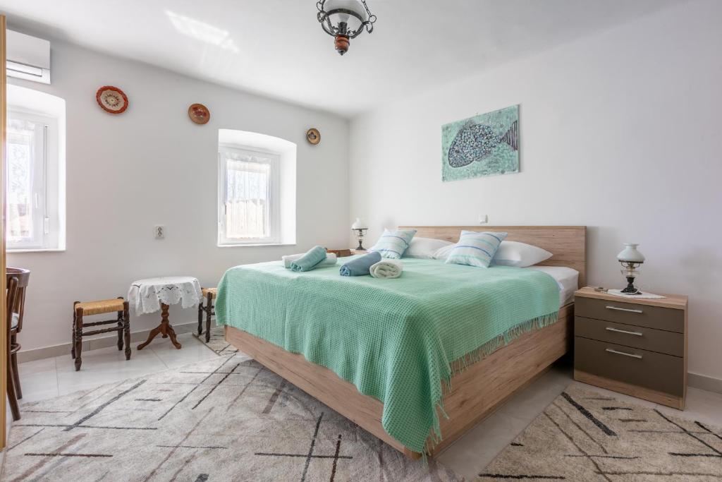 Postel nebo postele na pokoji v ubytování Holiday House Julija