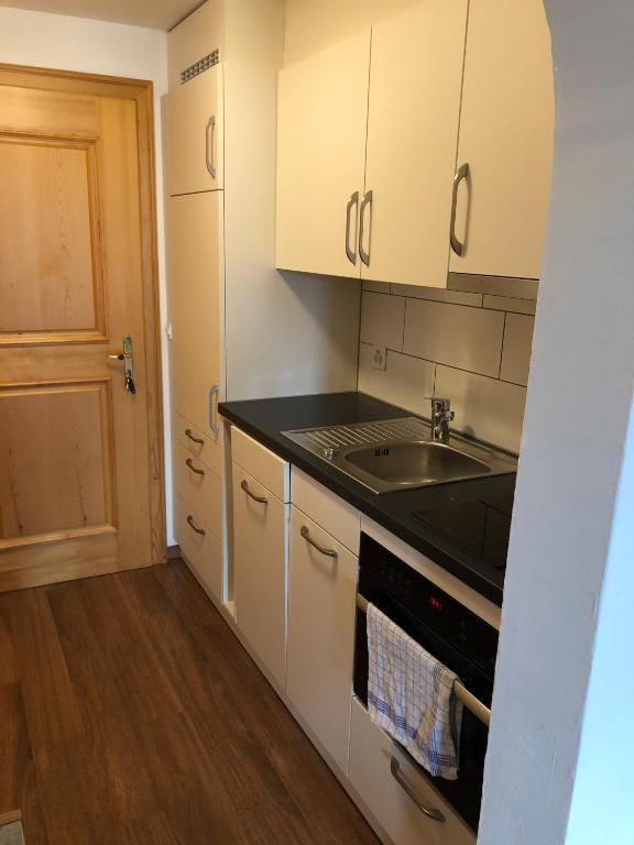 Kuchyň nebo kuchyňský kout v ubytování Moderne Ferienwohnung in Laax - Modern apartment in Laax