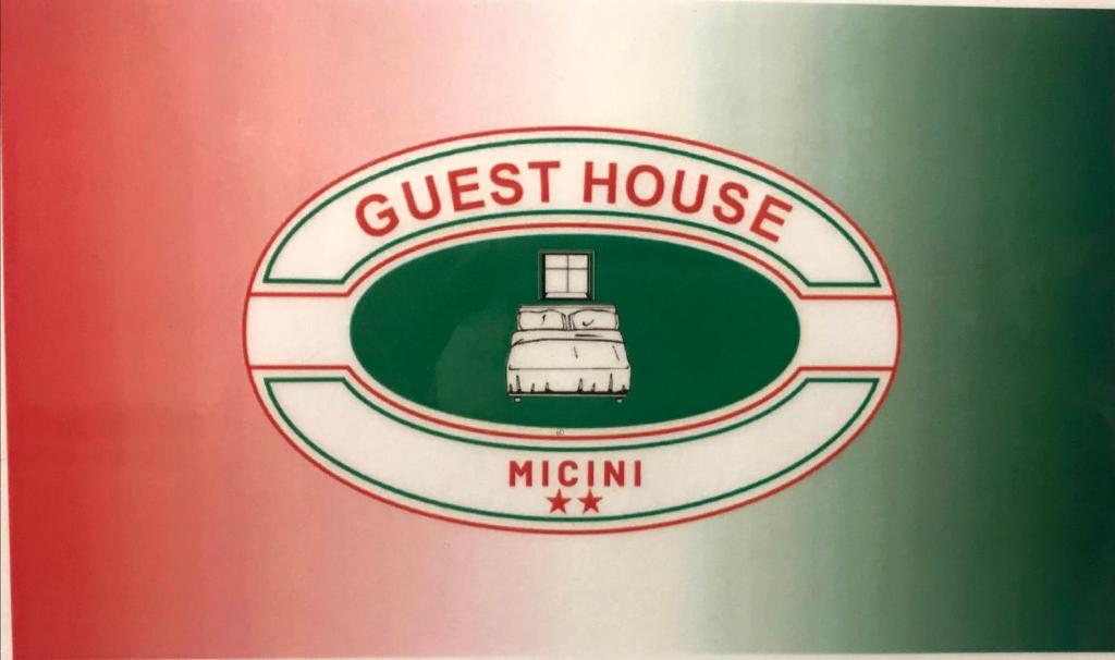 a close up of a guest house sign with a lighthouse at Guest House MICINI in Druento
