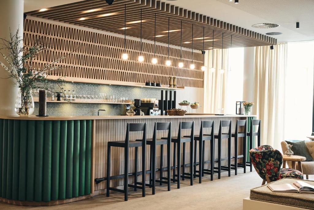 Reštaurácia alebo iné gastronomické zariadenie v ubytovaní Ullrhaus