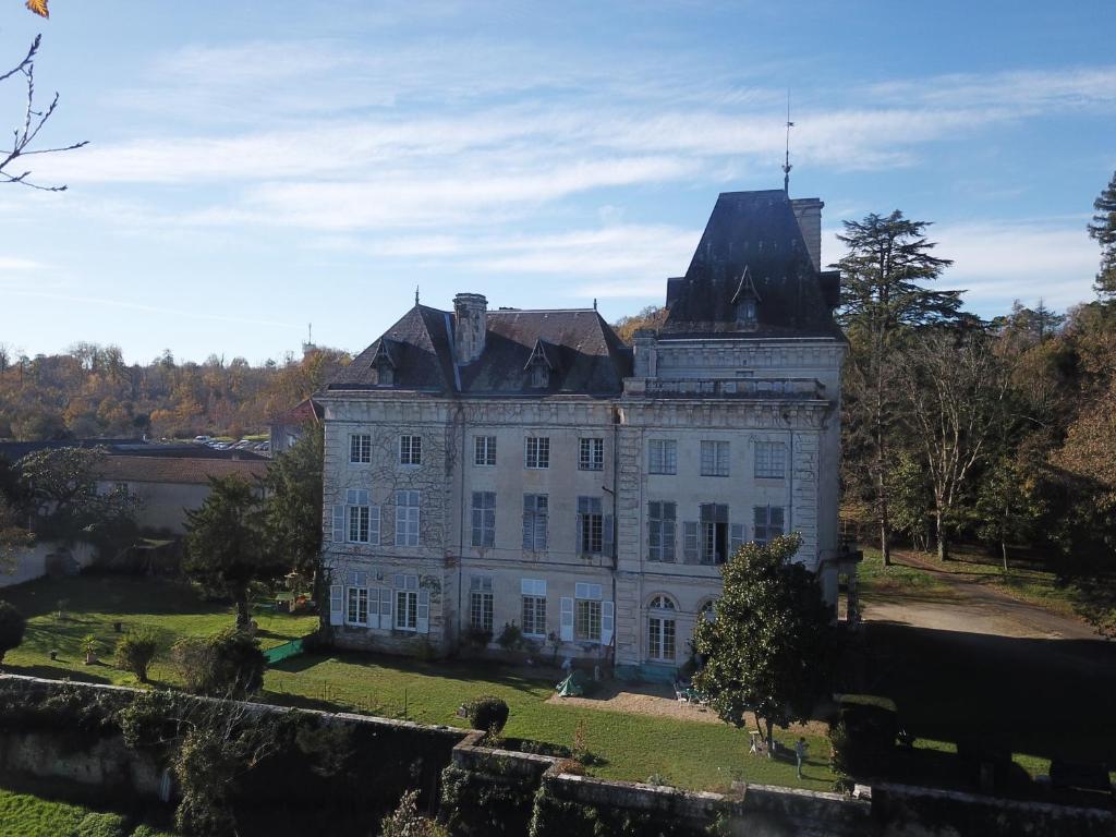 an old castle with a tower on top of it at Château de Chasseneuil sur Bonnieure in Chasseneuil-sur-Bonnieure