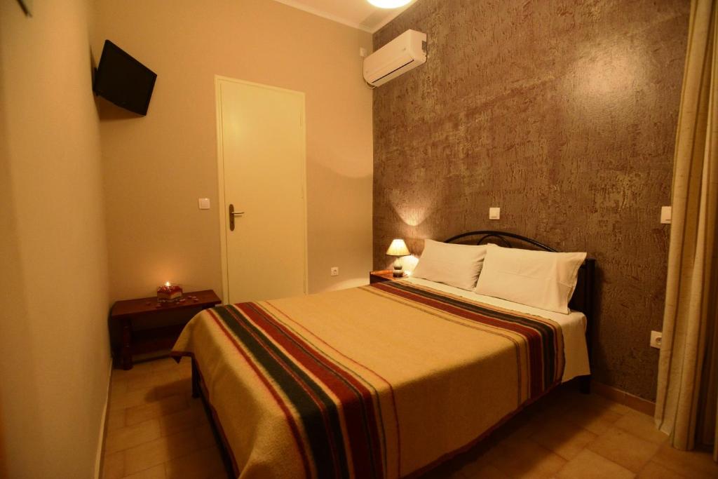 Postel nebo postele na pokoji v ubytování Argo Hotel