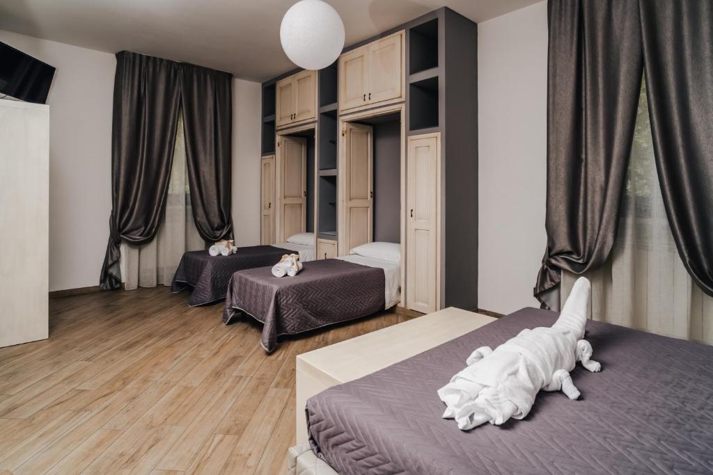 Postel nebo postele na pokoji v ubytování Holiday Gli Archi
