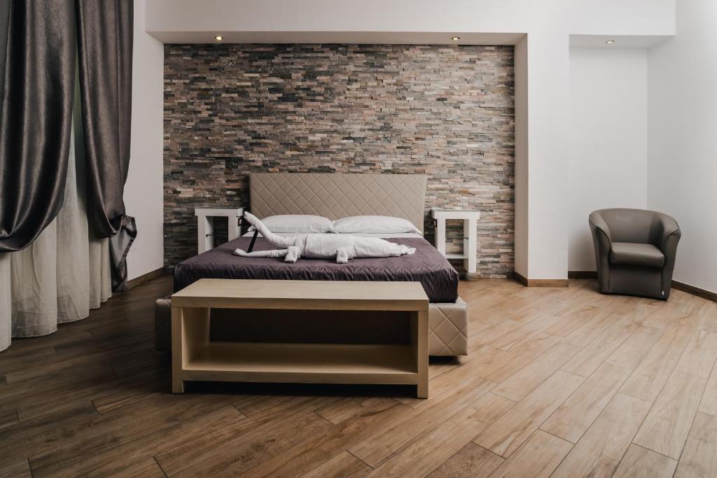 Postel nebo postele na pokoji v ubytování Holiday Gli Archi