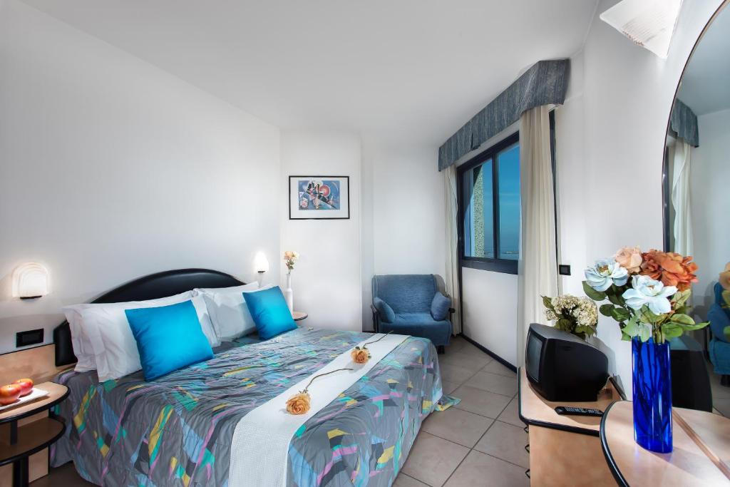 Postel nebo postele na pokoji v ubytování Lido Hotel Residence