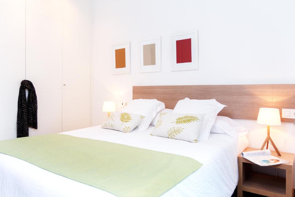 Posteľ alebo postele v izbe v ubytovaní Feelathome Plaza Apartments