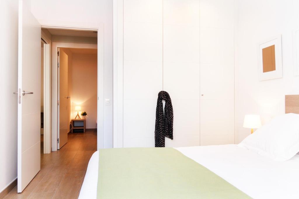 Posteľ alebo postele v izbe v ubytovaní Feelathome Plaza Apartments