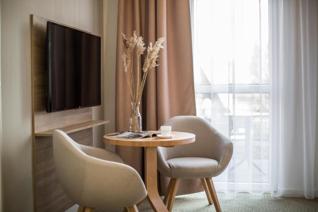 Telewizja i/lub zestaw kina domowego w obiekcie Molo Park Aparthotel