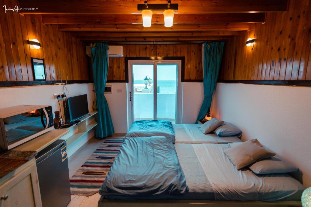 Postel nebo postele na pokoji v ubytování Skyrock Dahab
