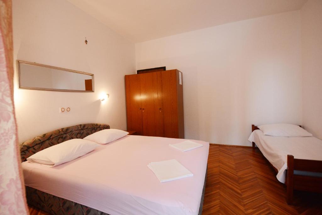 Postel nebo postele na pokoji v ubytování Apartments Ante1