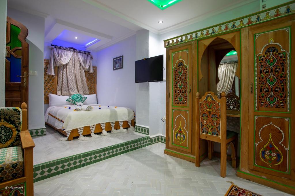 Postel nebo postele na pokoji v ubytování Hotel Dar Mounir