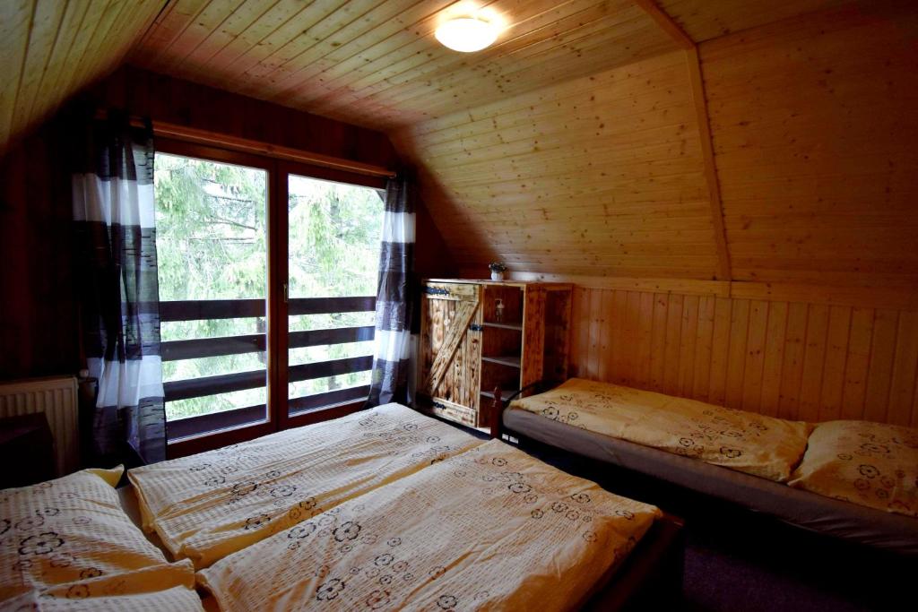 Postel nebo postele na pokoji v ubytování Chata Daniela