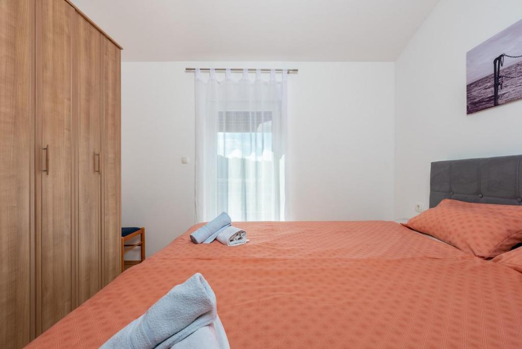 Posteľ alebo postele v izbe v ubytovaní Holiday House Dora