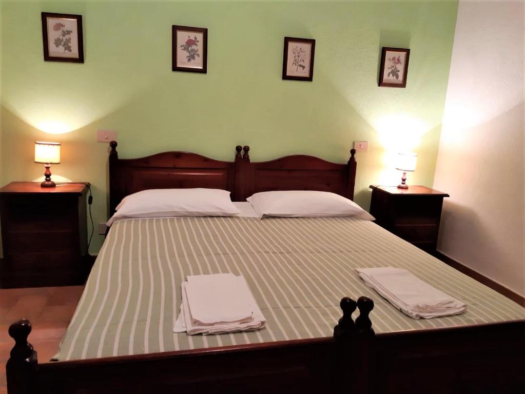 Postel nebo postele na pokoji v ubytování Agriturismo Malpasso