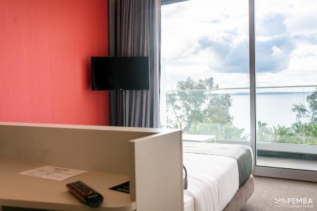 TV a/nebo společenská místnost v ubytování Pemba Express Hotel
