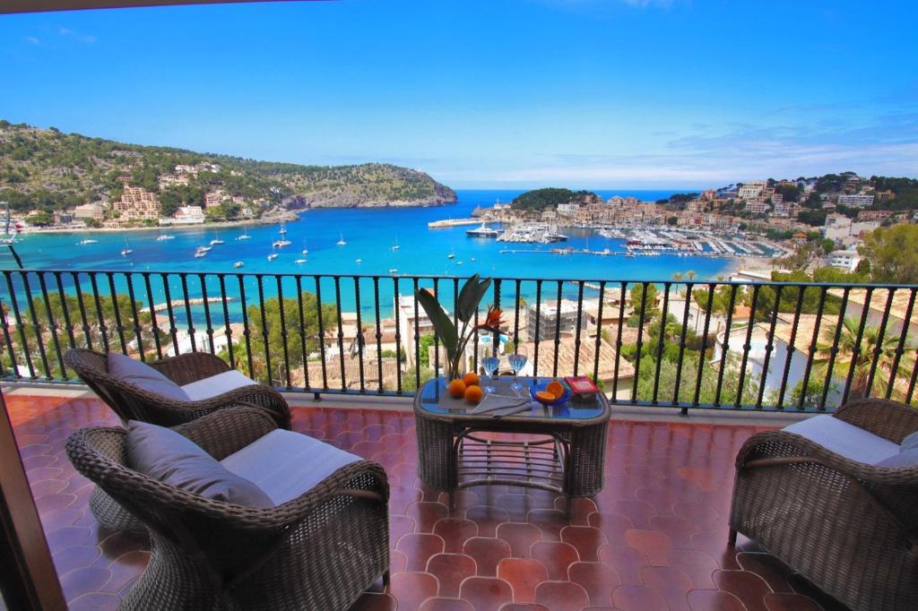 a balcony with a table and chairs and the ocean at Marbat Plus in Port de Soller