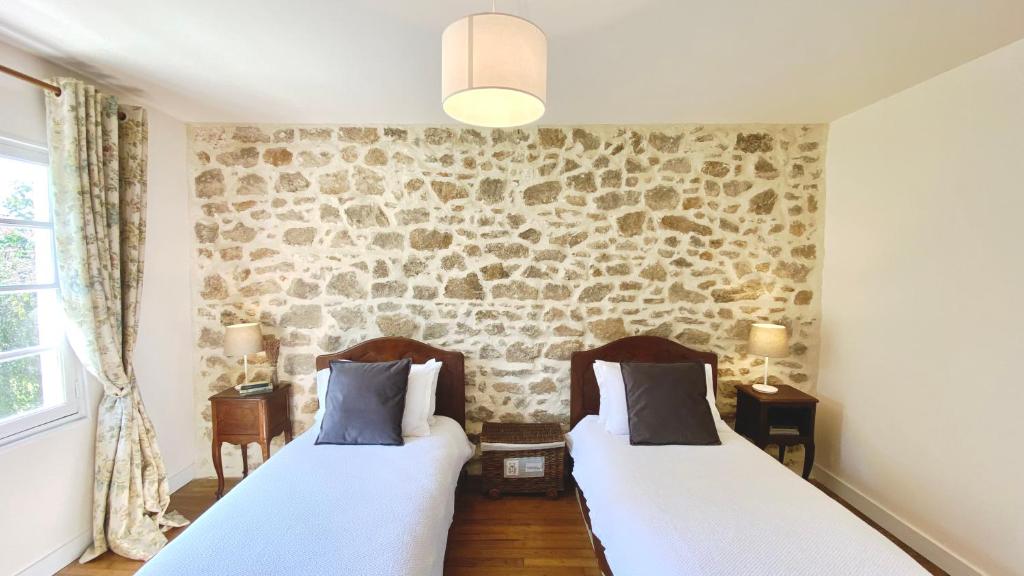 Ένα ή περισσότερα κρεβάτια σε δωμάτιο στο La Châtaigne
