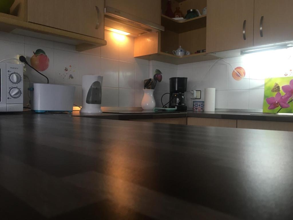 A kitchen or kitchenette at First Line Beach Apartment with Ocean View La Arena