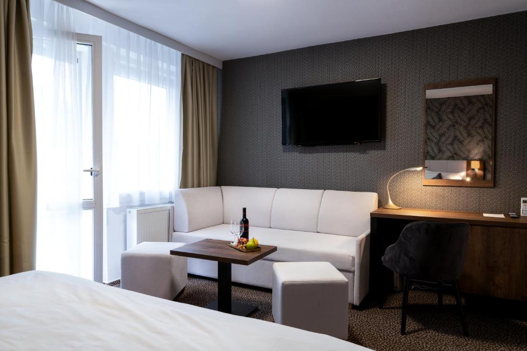 Postel nebo postele na pokoji v ubytování Hotel Karolina