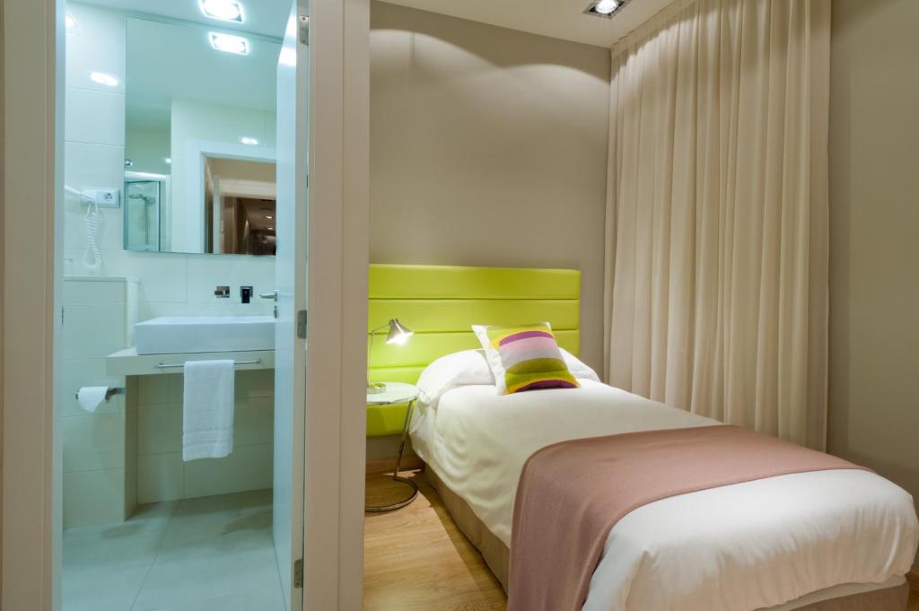 Postel nebo postele na pokoji v ubytování BacHome Terrace B&B