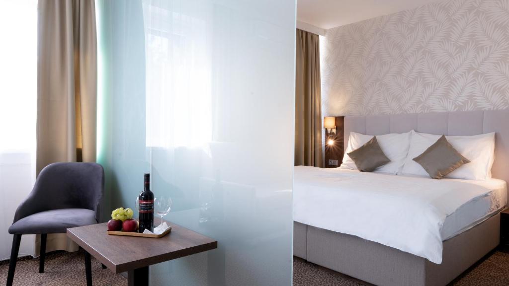 Postel nebo postele na pokoji v ubytování Hotel Karolina