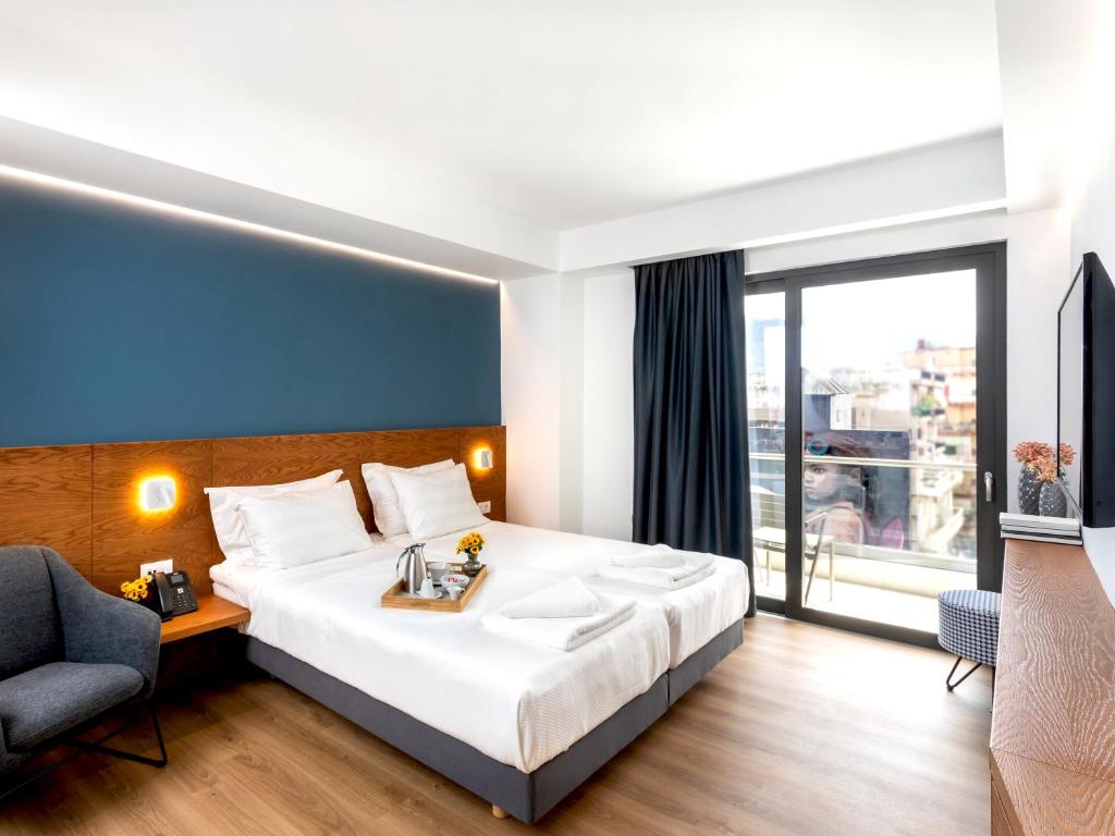 Postel nebo postele na pokoji v ubytování DAYS City Suites