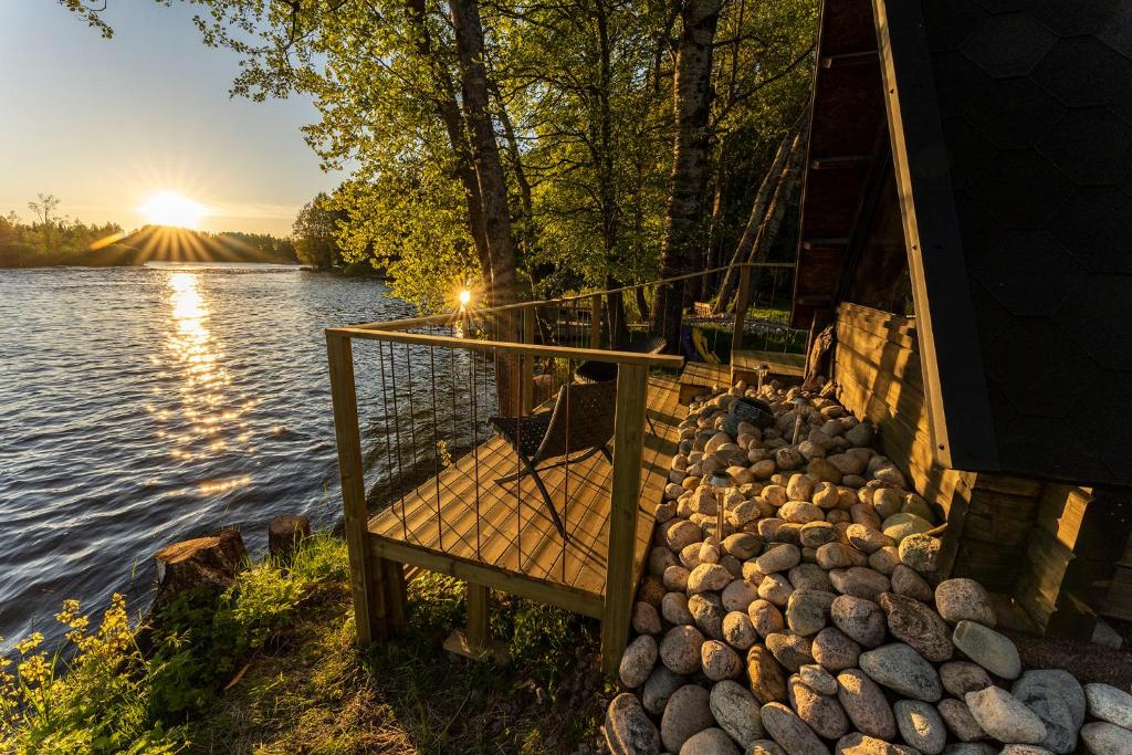 a bunch of rocks on the side of a lake at Laawu Kultaa in Kotka