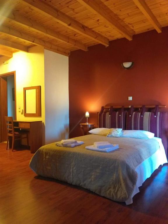 Postel nebo postele na pokoji v ubytování Ξενώνας questhouse Electra isari